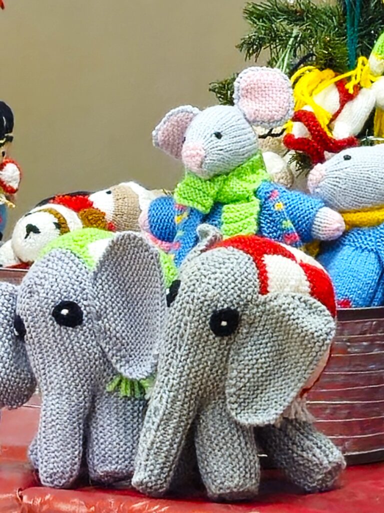 Knitted soft toy elephants